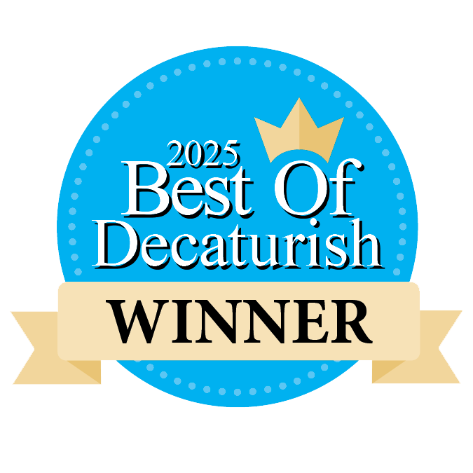 Award badge with a blue circular background, a gold crown at the top, and a beige ribbon banner reading "WINNER". Text on the badge says "2025 Best Of Decaturish".