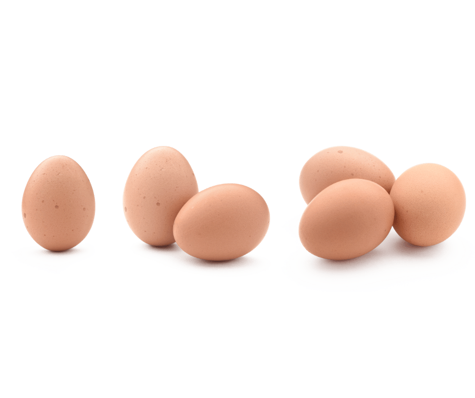 Six brown eggs arranged in two groups on a white surface with a black background.