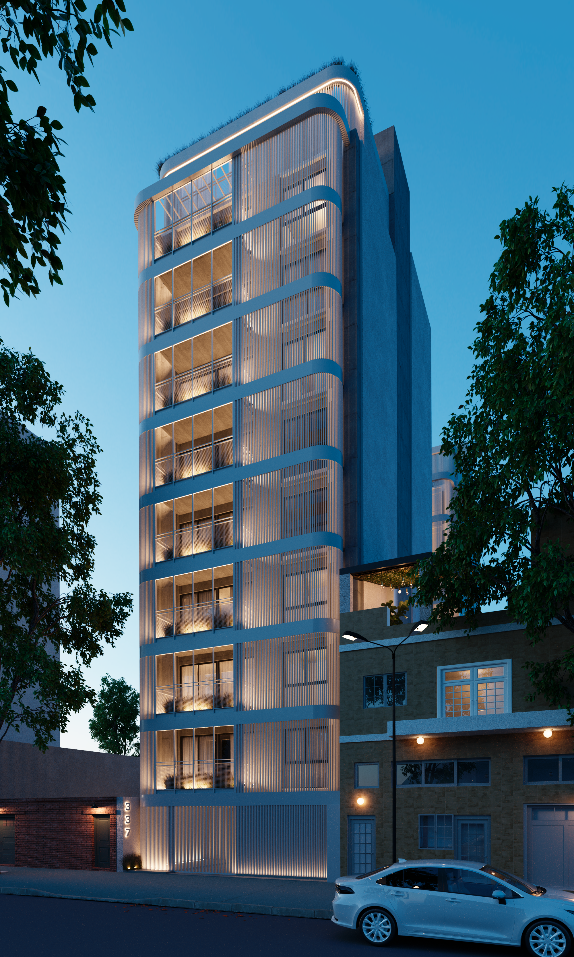 A modern multi-story residential building with curved balconies and vertical light fixtures on a city street at dusk, surrounded by trees and neighboring buildings.