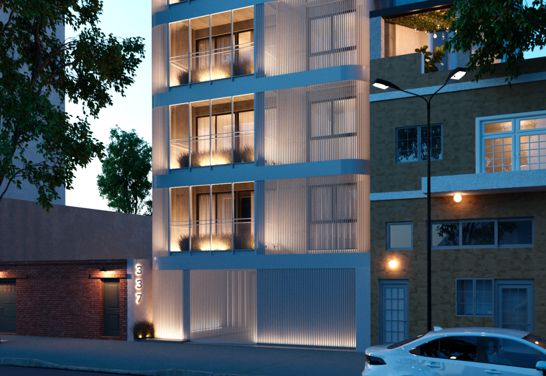 Modern multi-story building at dusk with illuminated balconies, outdoor lighting, trees, and a parking area with a white car.