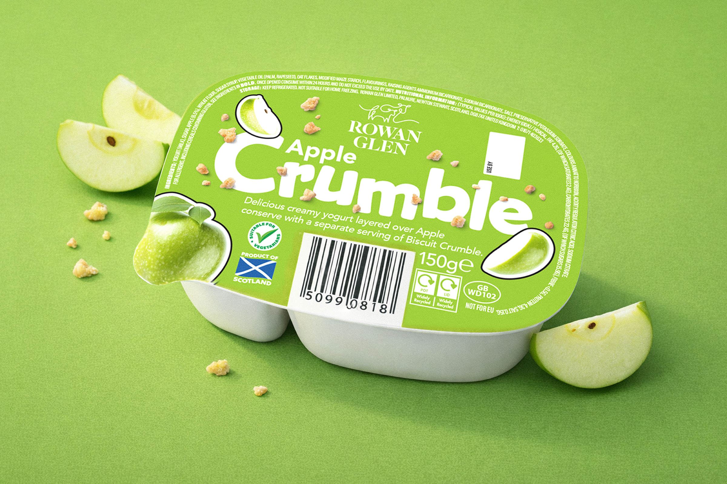 Green package of Rowan Glen Apple Crumble with apple slices and crumbs scattered around on a green background.