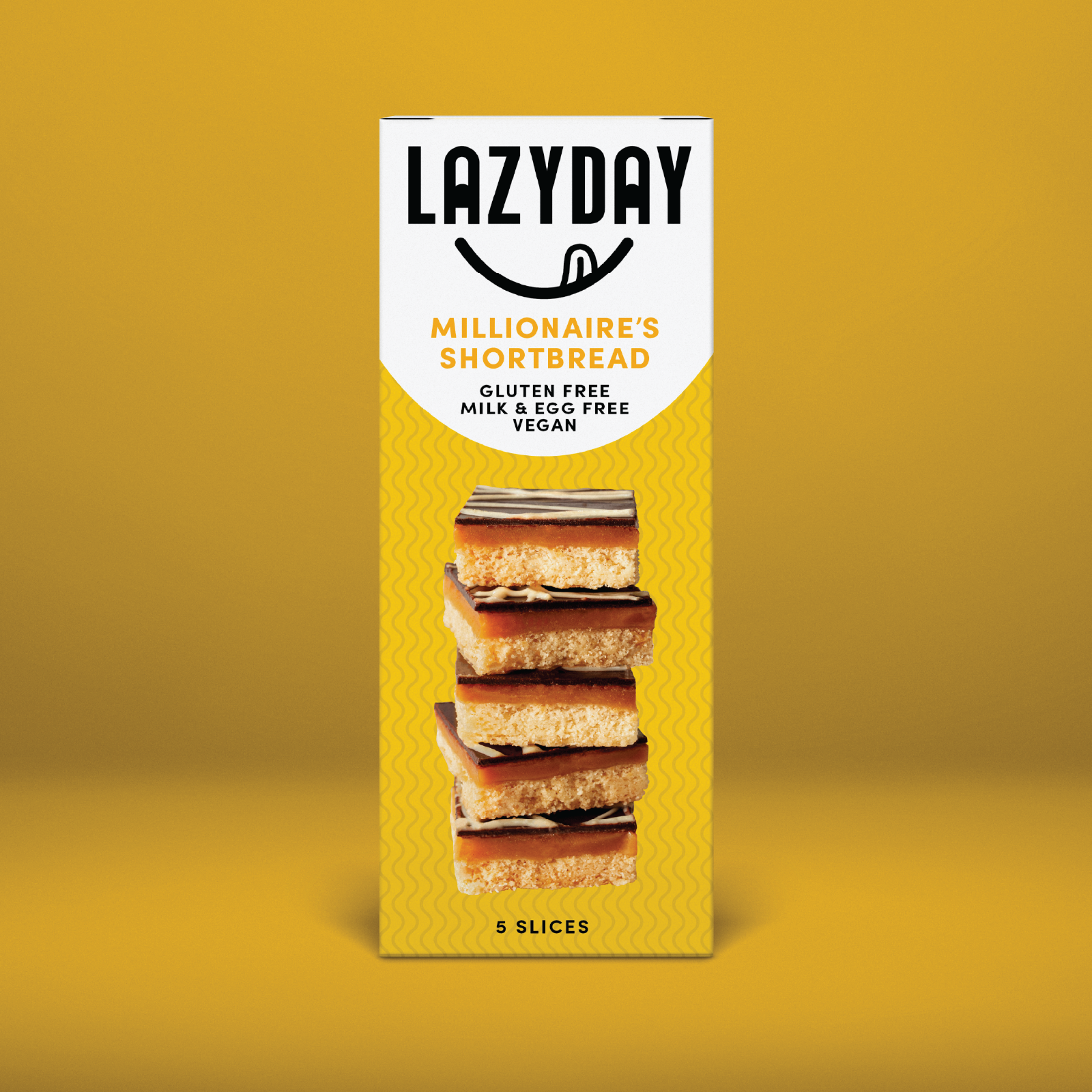 Yellow box of LazyDay Millionaire's Shortbread with five slices, gluten free, dairy free, vegan.