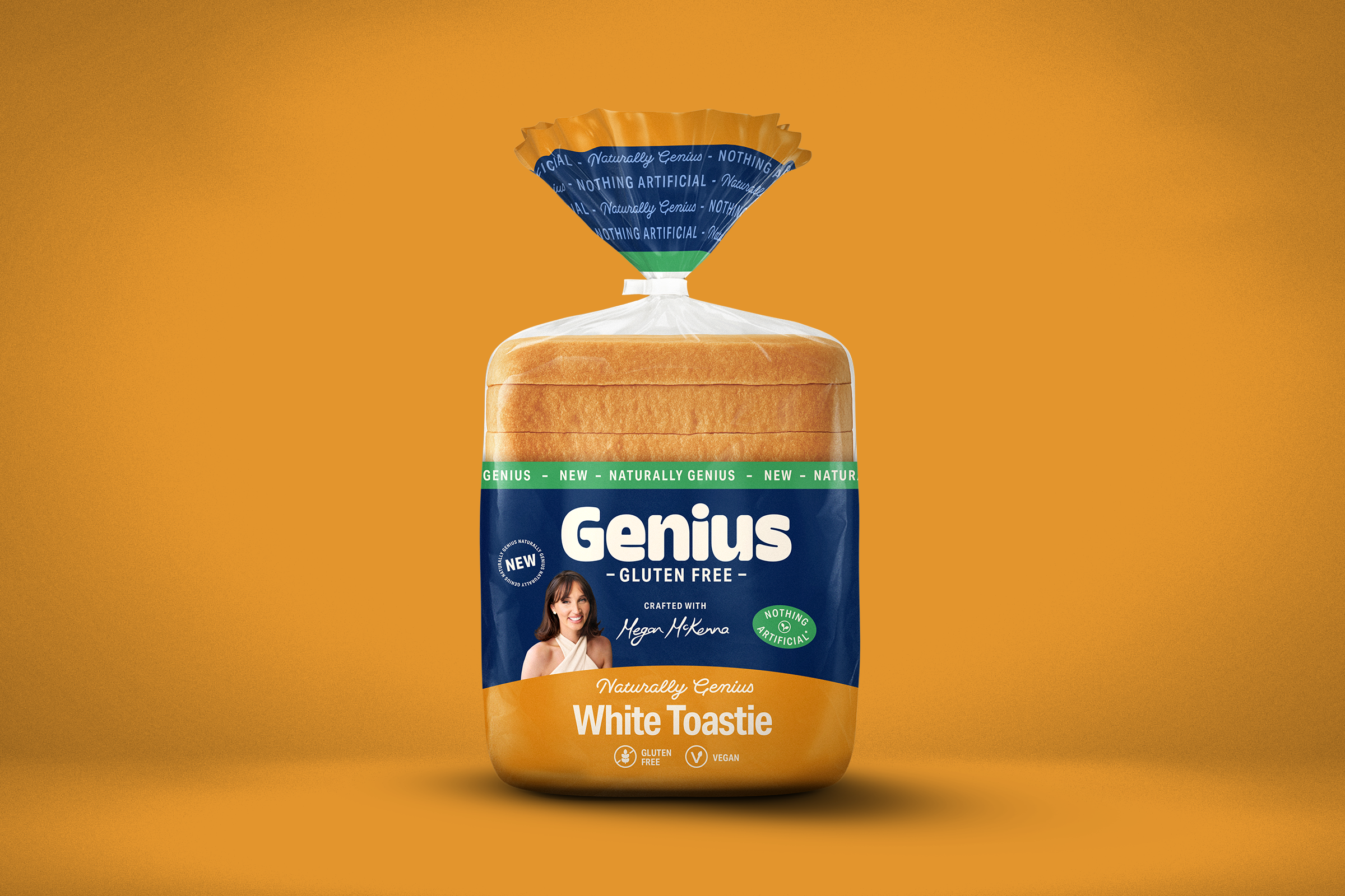 A loaf of Genius gluten-free White Toastie bread in blue and orange packaging with a picture of Megan Mckenna, set against a solid orange background.