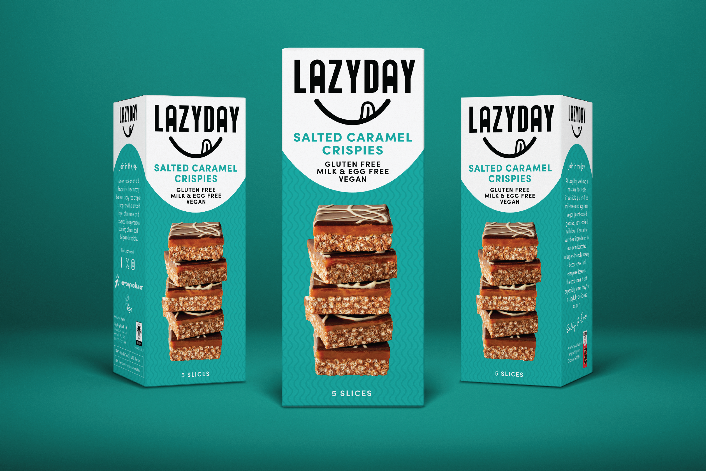 Three boxes of Lazyday salted caramel crispies, with the center box prominently displayed and the others slightly behind. The packaging is turquoise with black and white text, and an image of five stacked caramel crispies on each box.