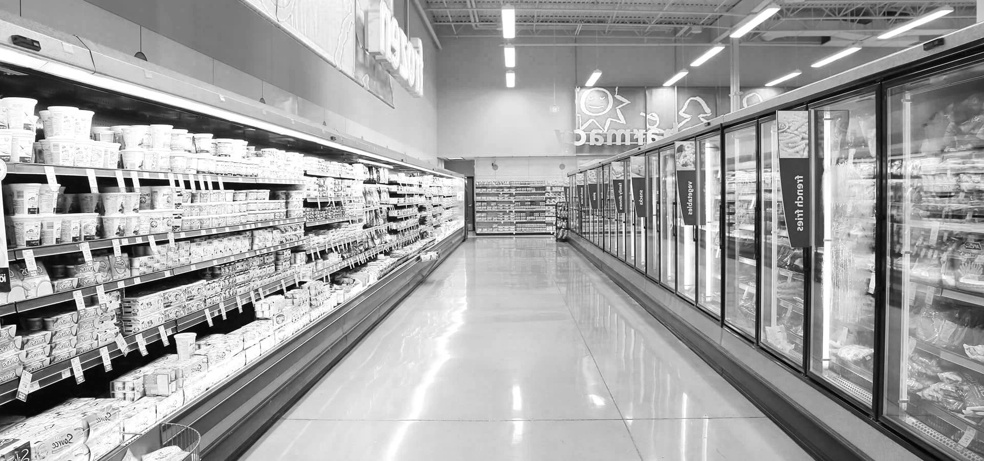Custom retail display refrigeration with high-visibility glass reach-in doors for a grocery store build.