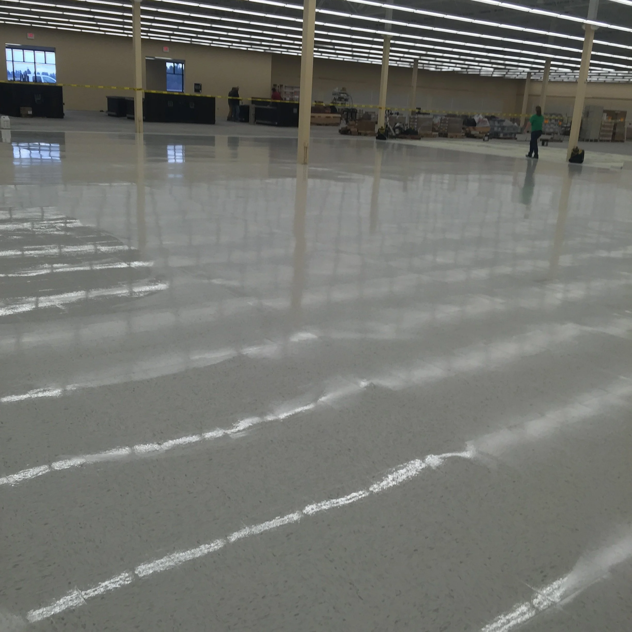 A Commercial Space in the process of having the floors waxed by White Knight janitorial.