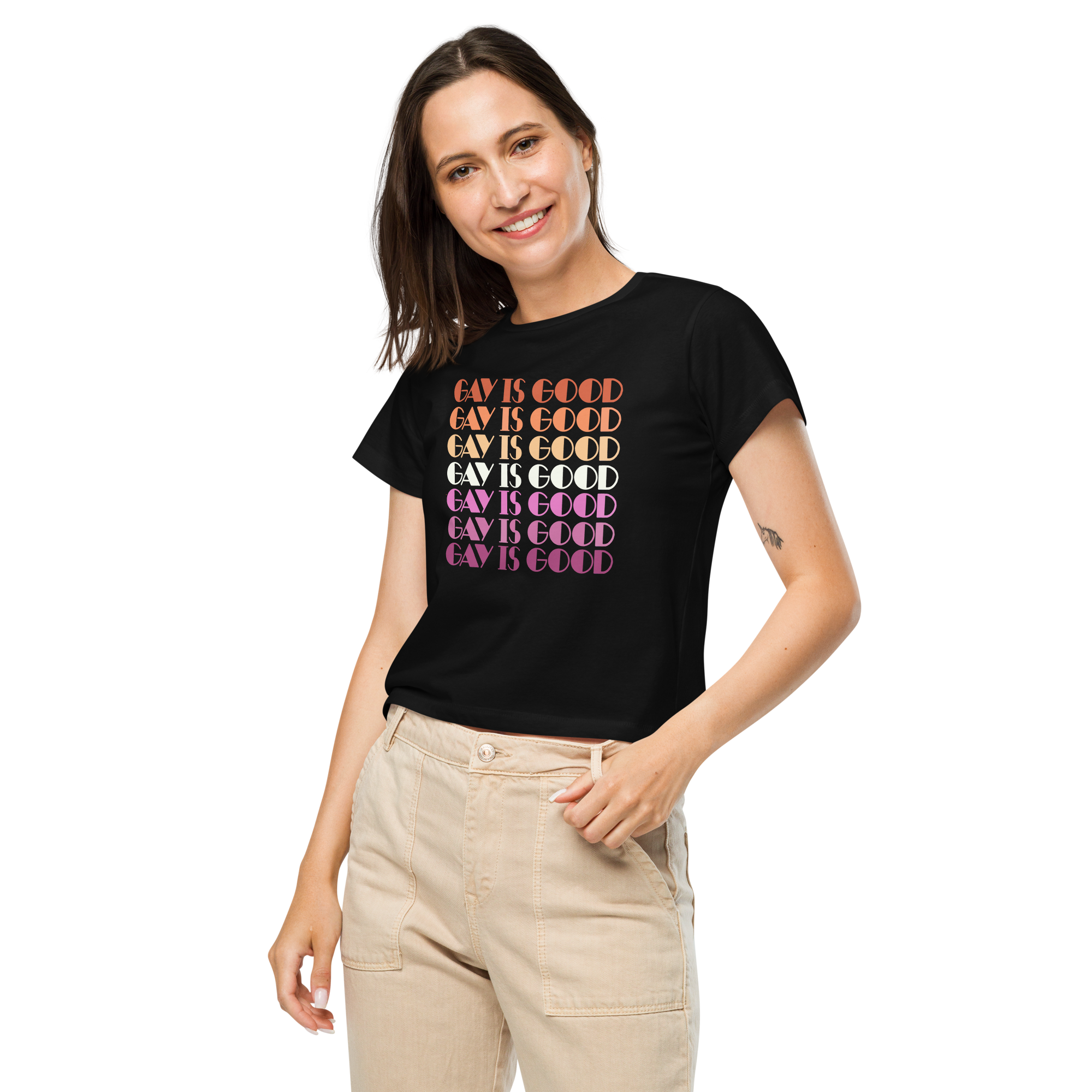 Detail of Gay Is Good lesbian pride graphic in pink, orange, and white colorway on women's tee on person