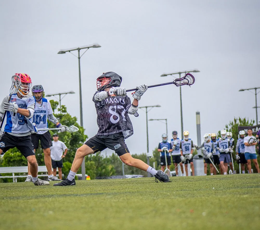 Player taking a shot on goal during offseason lacrosse training