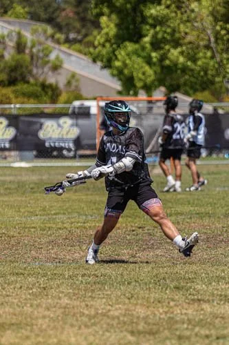 Lacrosse Player taking a shot on the goal