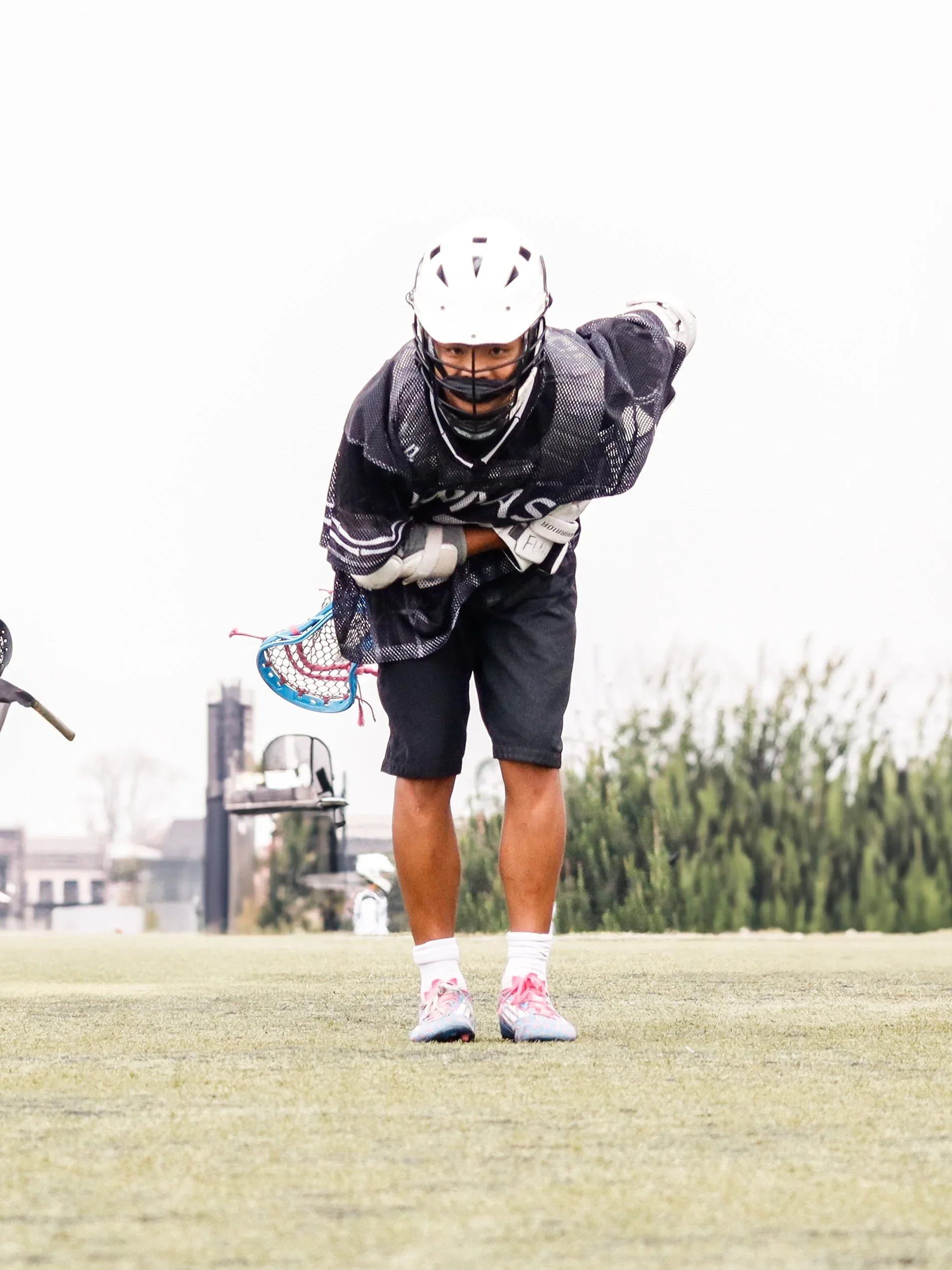 Panda Lacrosse players celebrating a goal during a competitive match