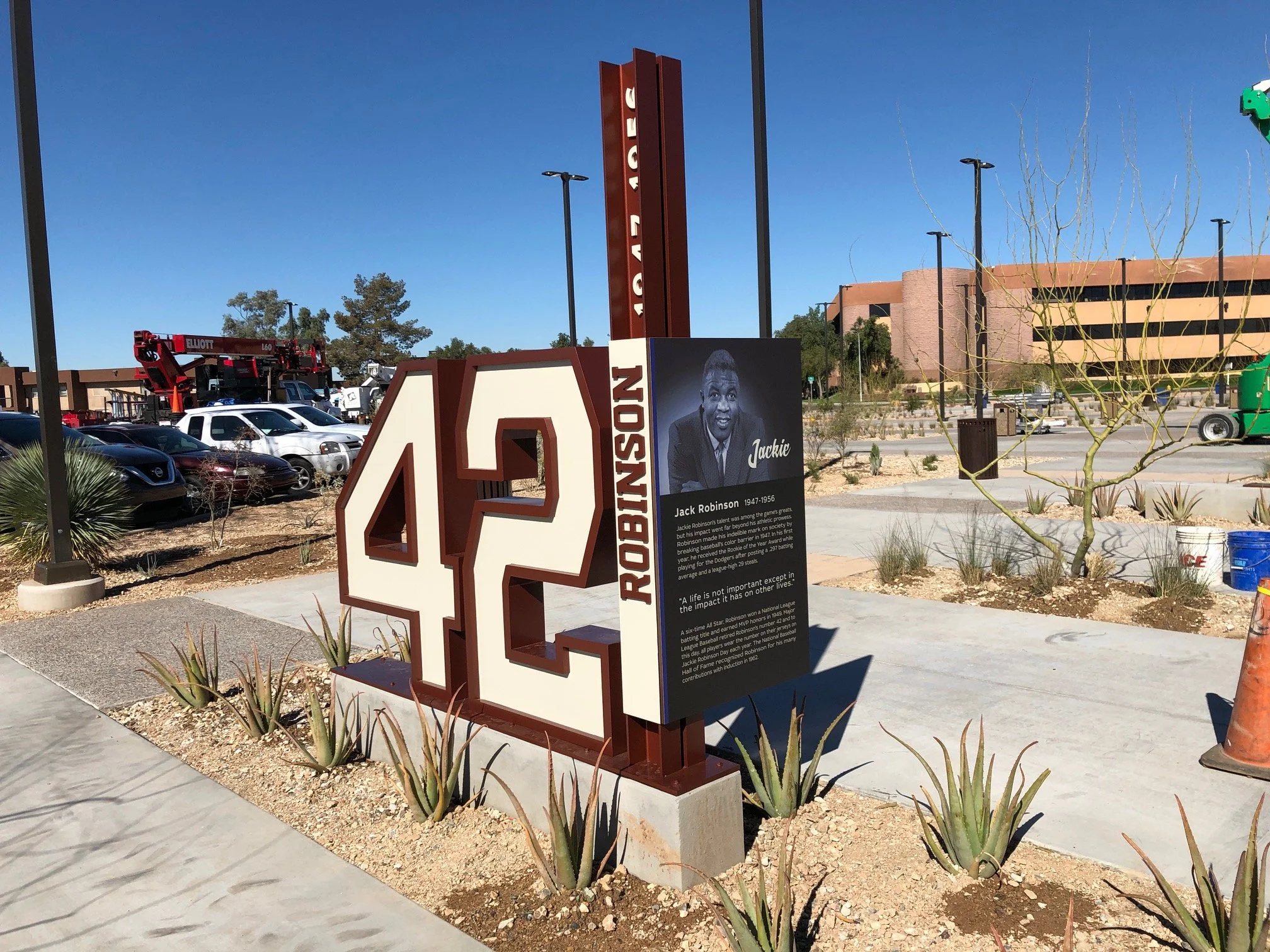 Historical museum style marker for Jack Robinson at Roe Robinson Park with large 42 sign and a black-and-white photo of Jack Robinson for the MLB Milwaukee Brewers. 