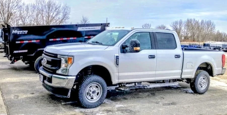 Erik's Junk Removal truck and dump trailer in Crystal Minnesota
