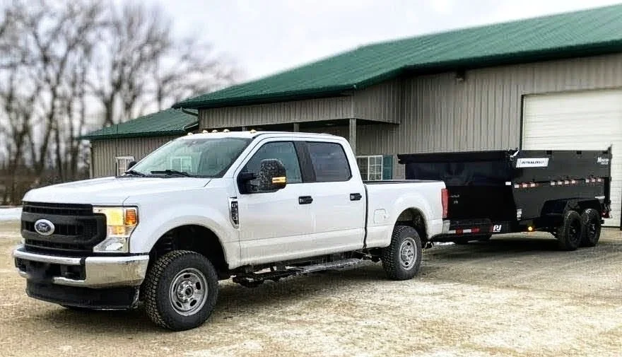 Erik's Junk Removal truck and dump trailer in Crystal Minnesota