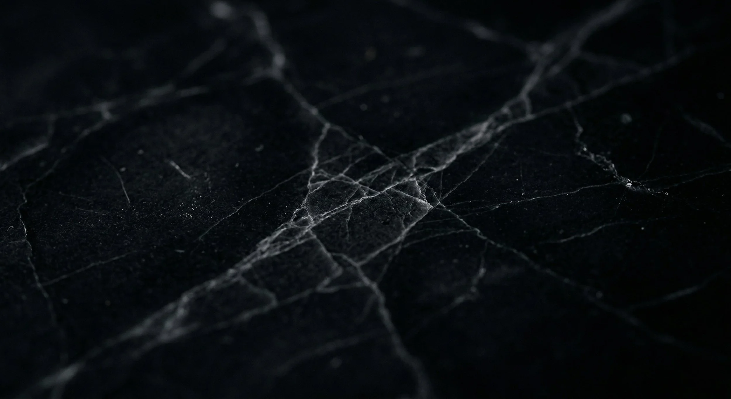 KAVERA men's collection — marble texture editorial background, luxury performance aesthetic