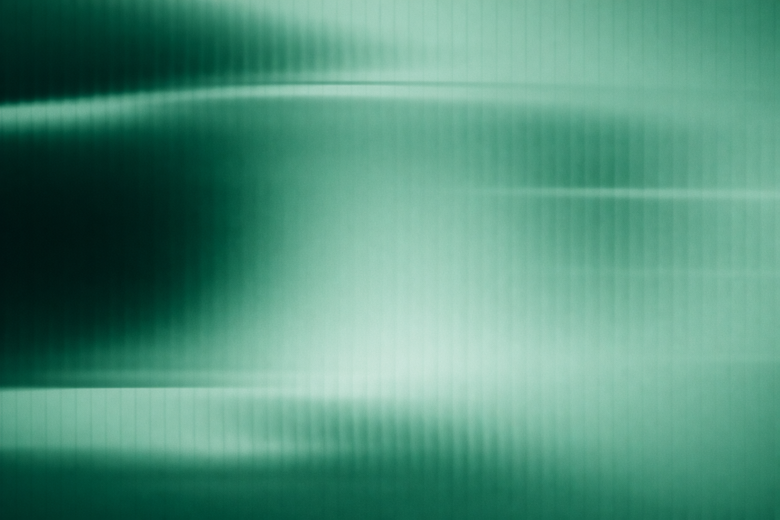 Abstrakt billede med grønne nuancer og lineteksturer.