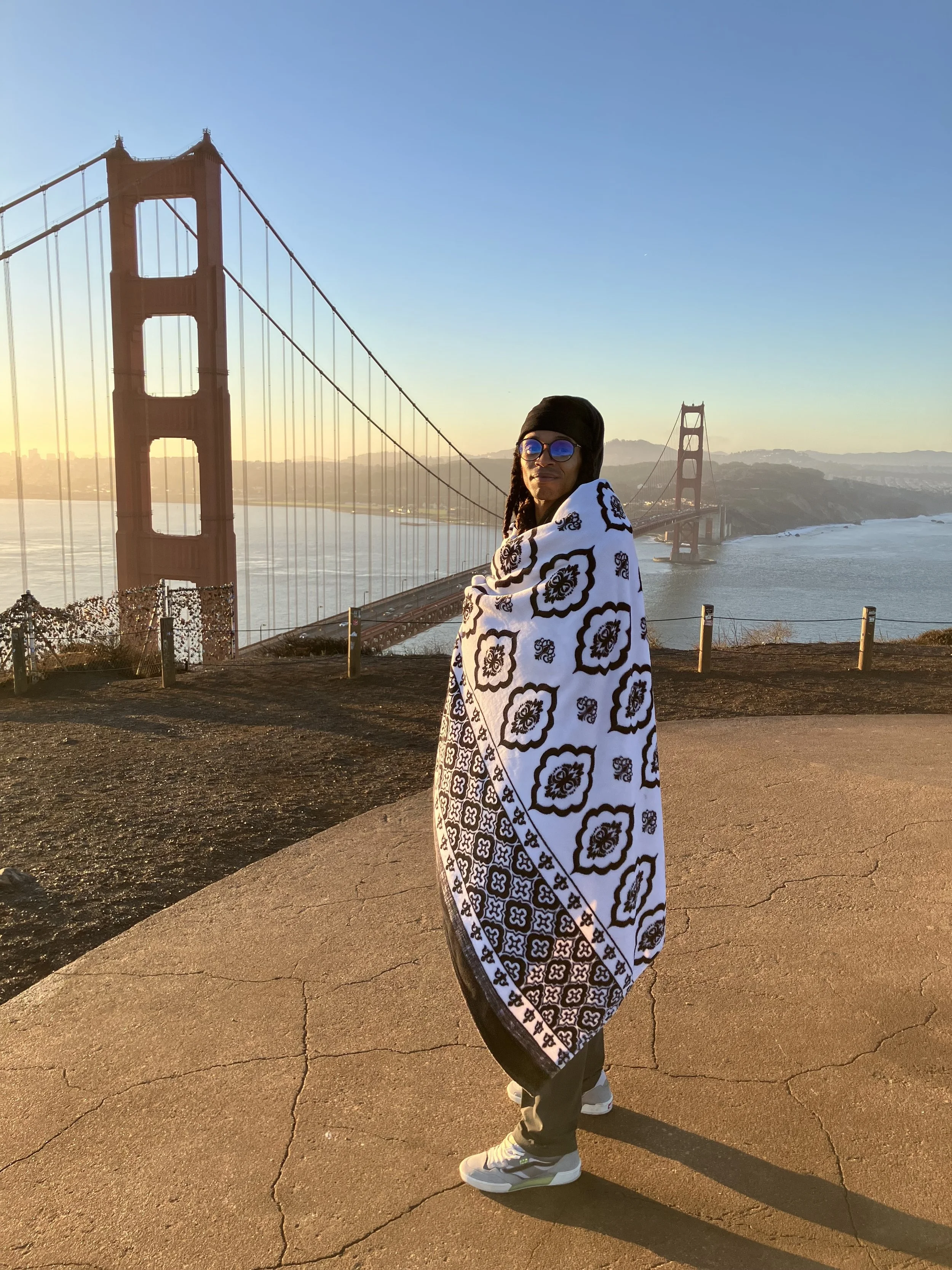 Taylor Stafford, a 6/2 Emotional Projector and Brand Architect, overlooking the Golden Gate Bridge. High-end brand strategy and copywriting for visionary founders.