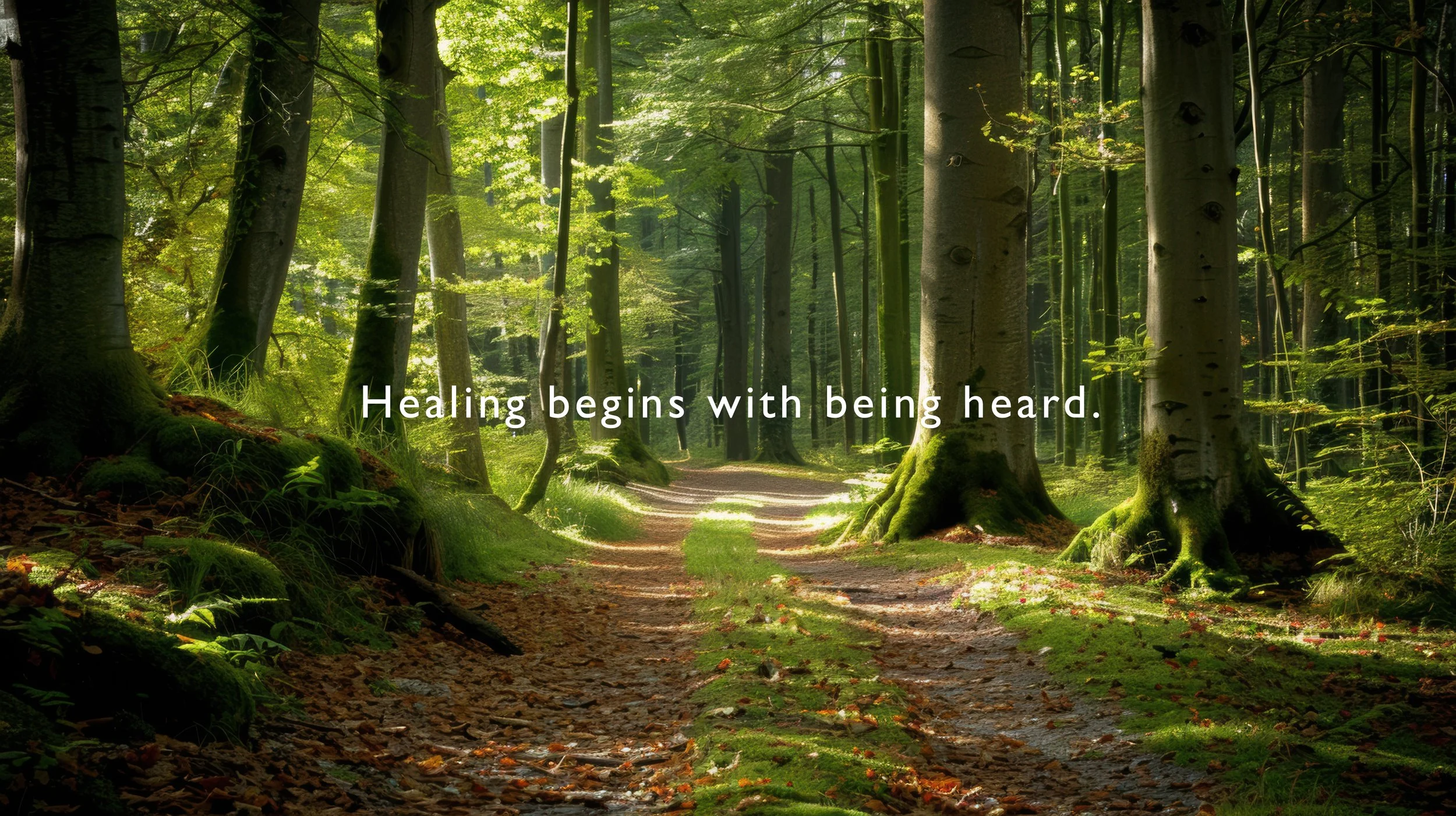 A sunlit forest path with tall trees and green moss, overlaid with the quote 'Healing begins with being heard.'