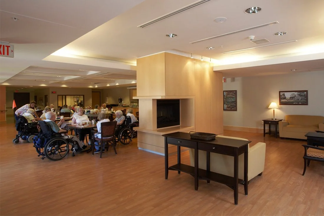 Seniors sitting together in a social area