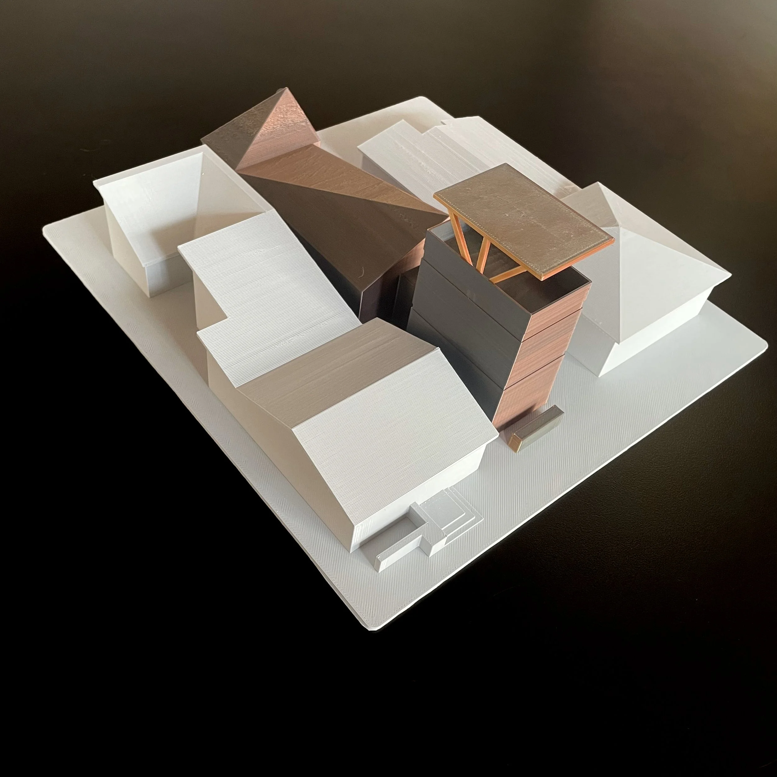 Architectural massing model viewed from an elevated rear angle