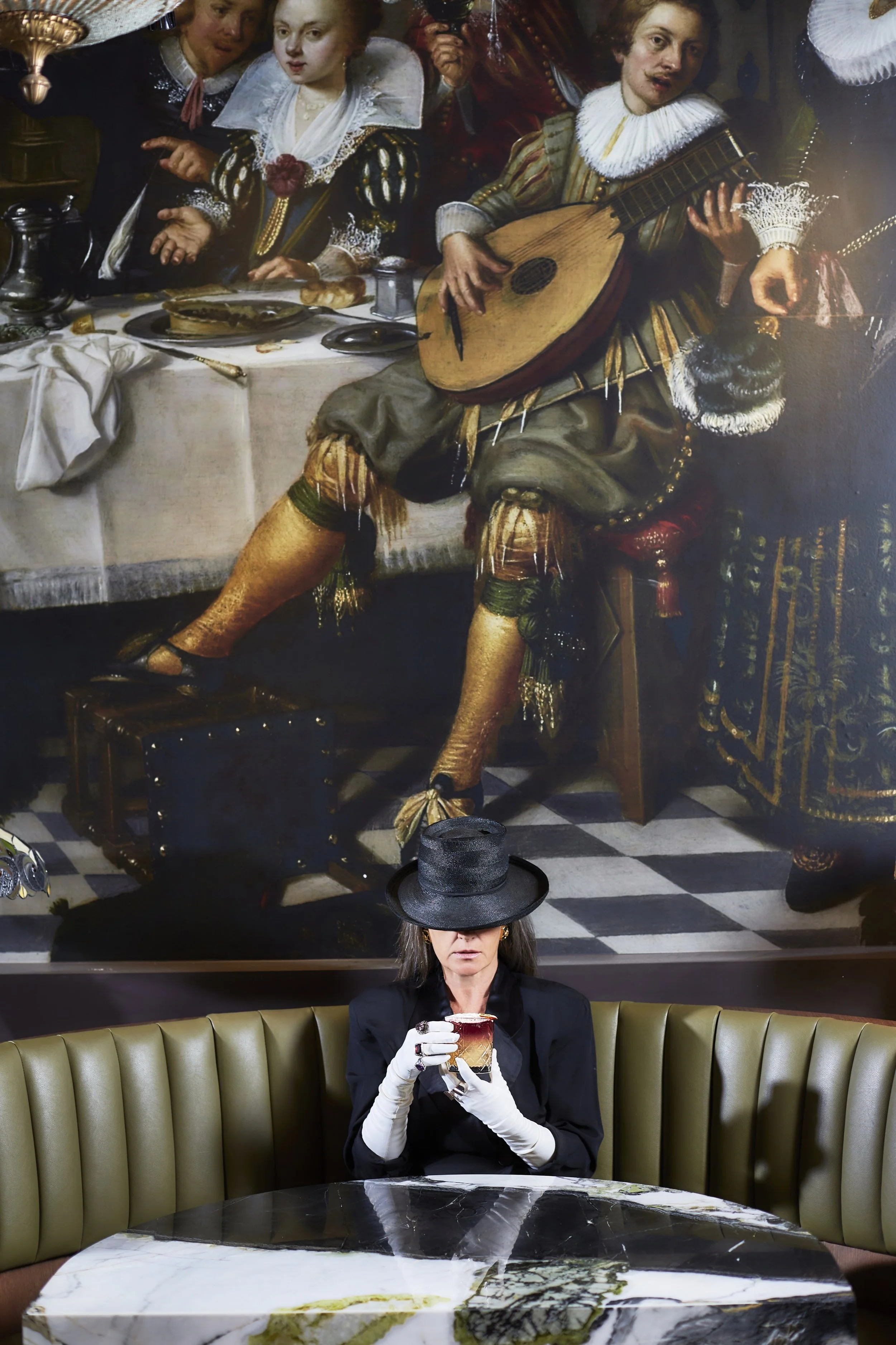 Person sitting at a booth in Rapscallion Restaurant