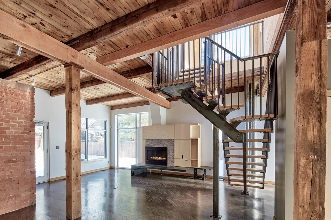 Living room with fireplace + stairs