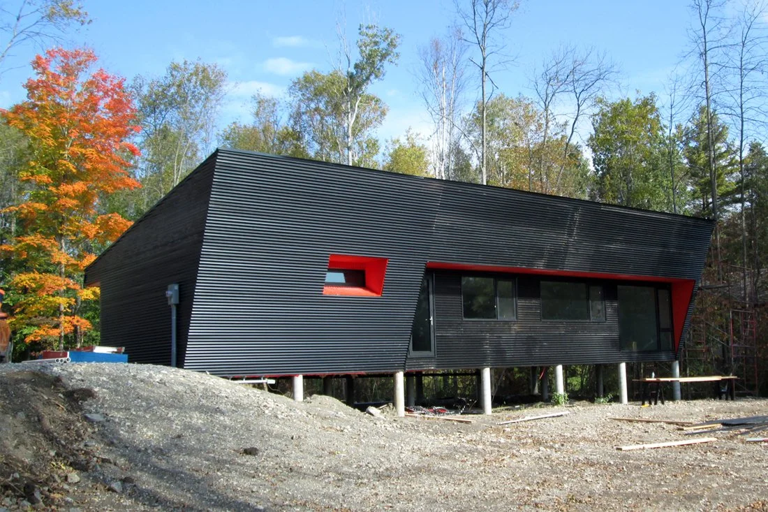 A simple, economical wood frame box, with sloping faces