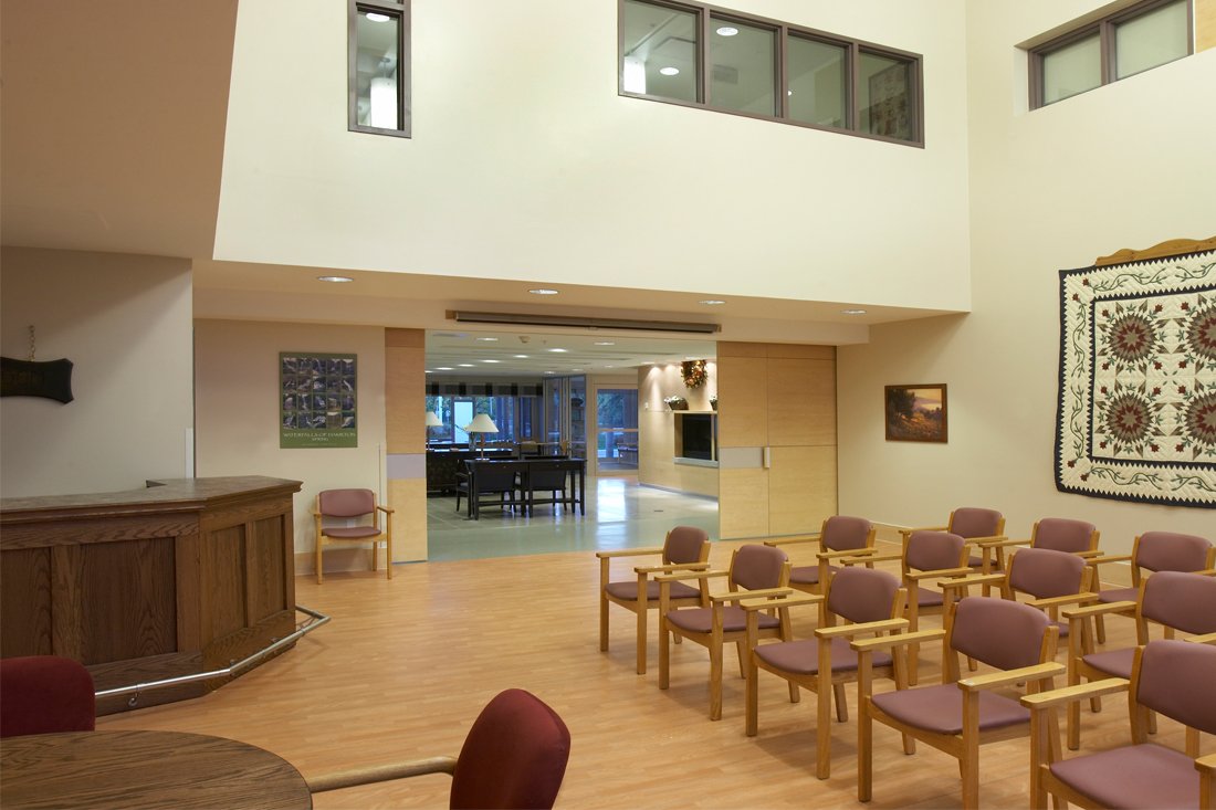 Rows of chairs set up in a conference room