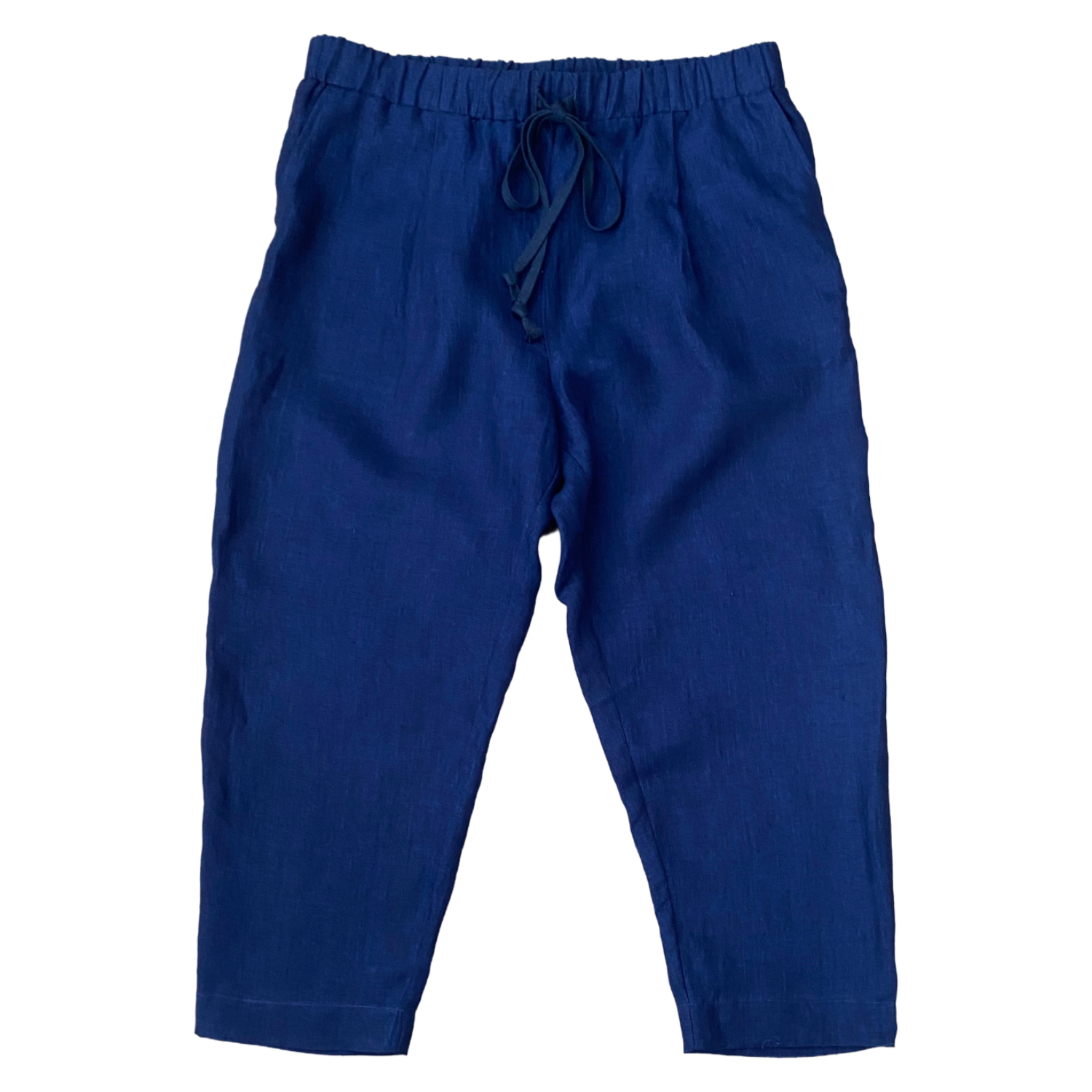 Blue casual pants with an elastic waistband and drawstring, laid flat.   Made with the Elena Trouser Sewing Pattern from SewClothing.