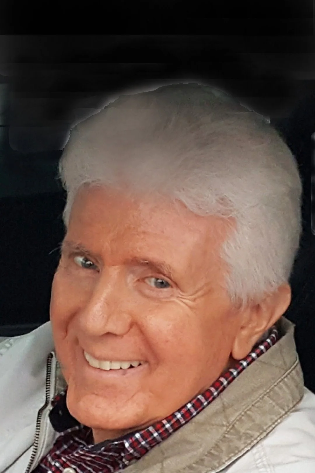 a headshot of r. nikolas macioci on a black background