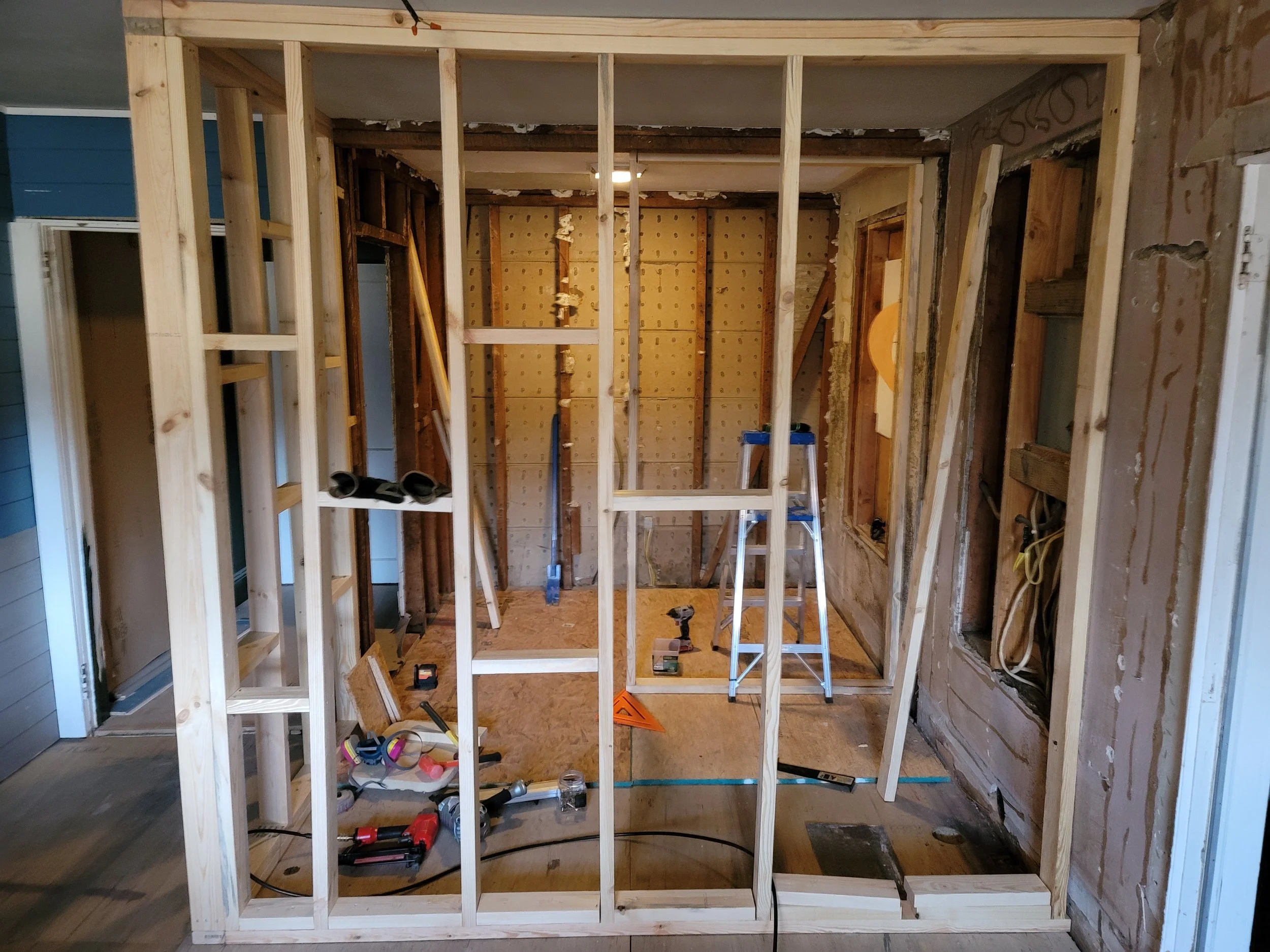 Bathroom - new kitchen wall going up.jpg