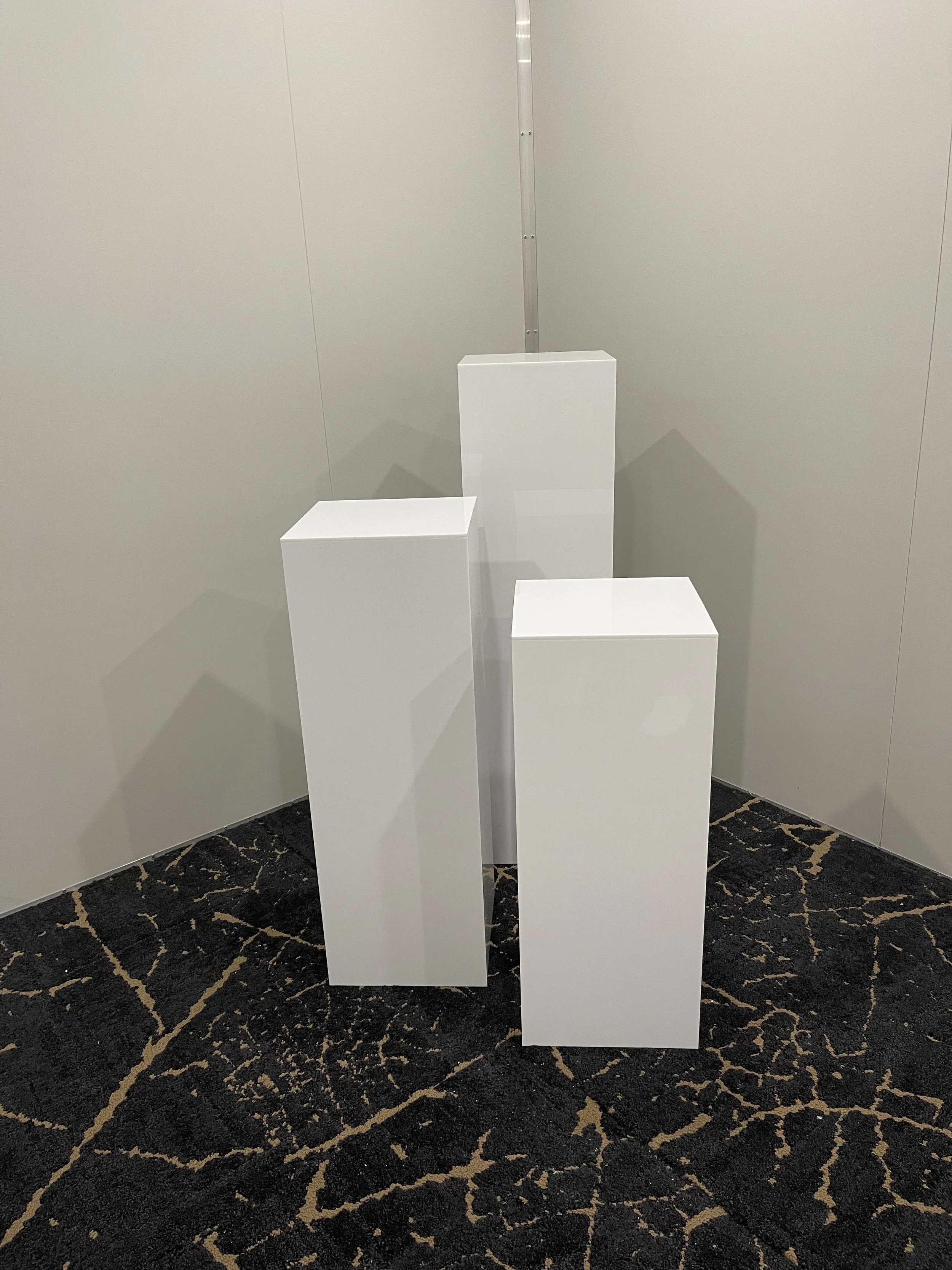 white acrylic square plinths.jpg
