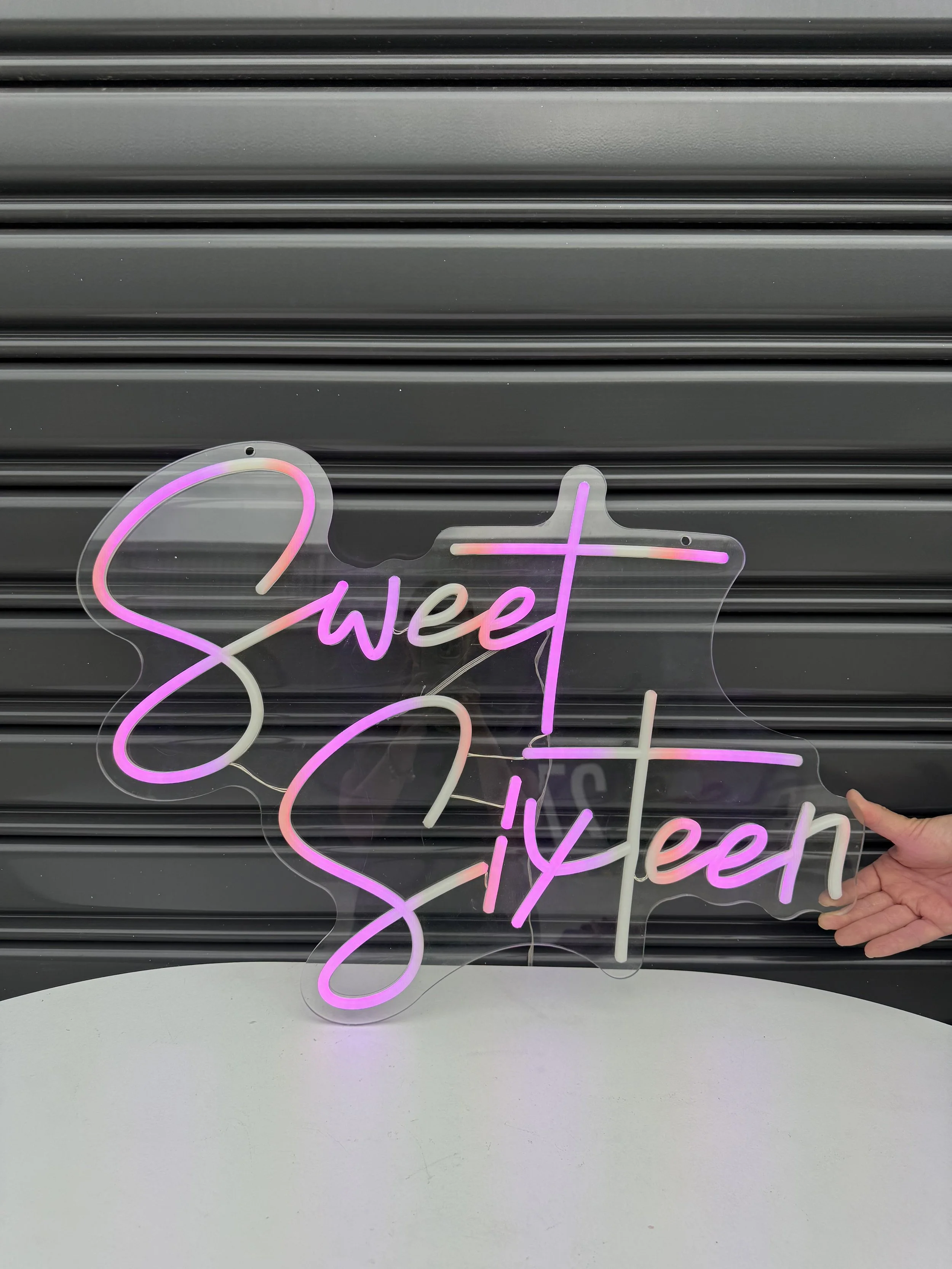 Neon_sign_Sweet_Sixteen_(lit_up).jpg