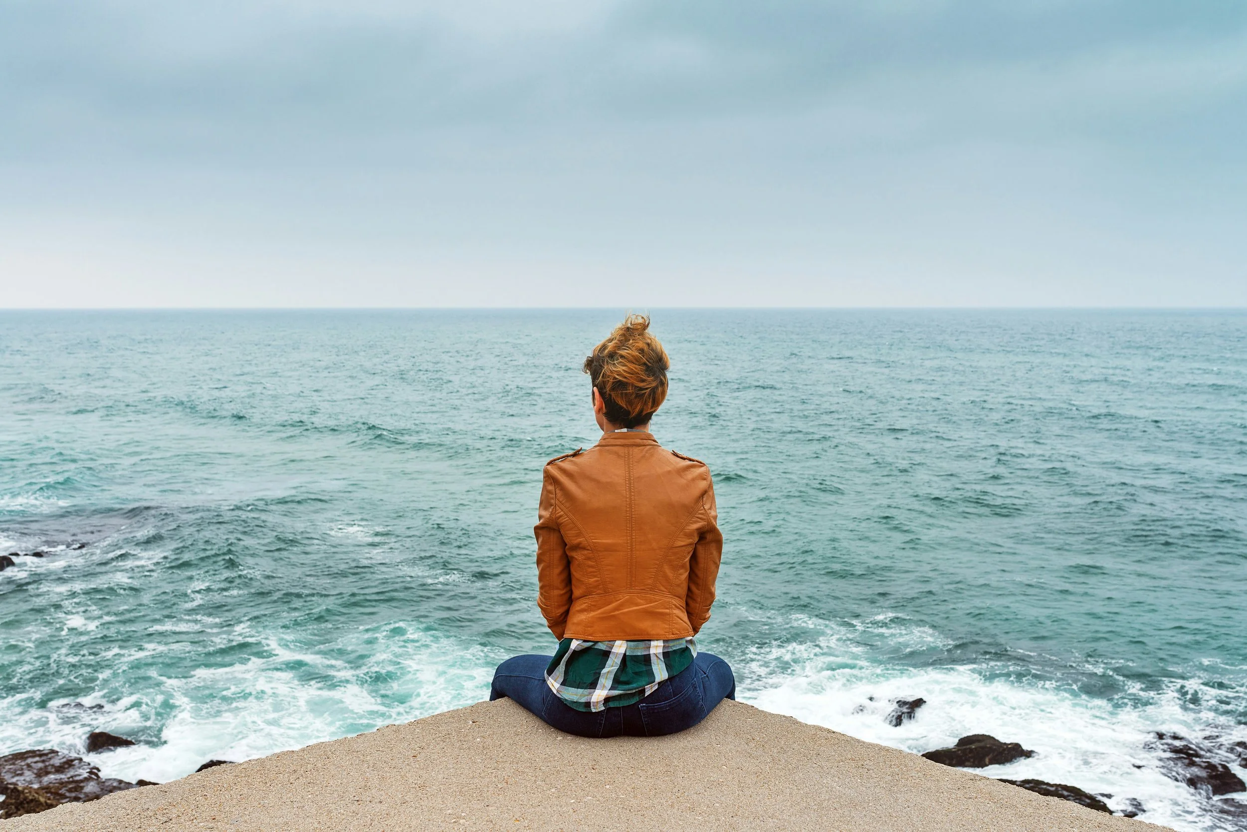 Woman reflecting on a new phase of life, representing the phases of womanhood in therapy