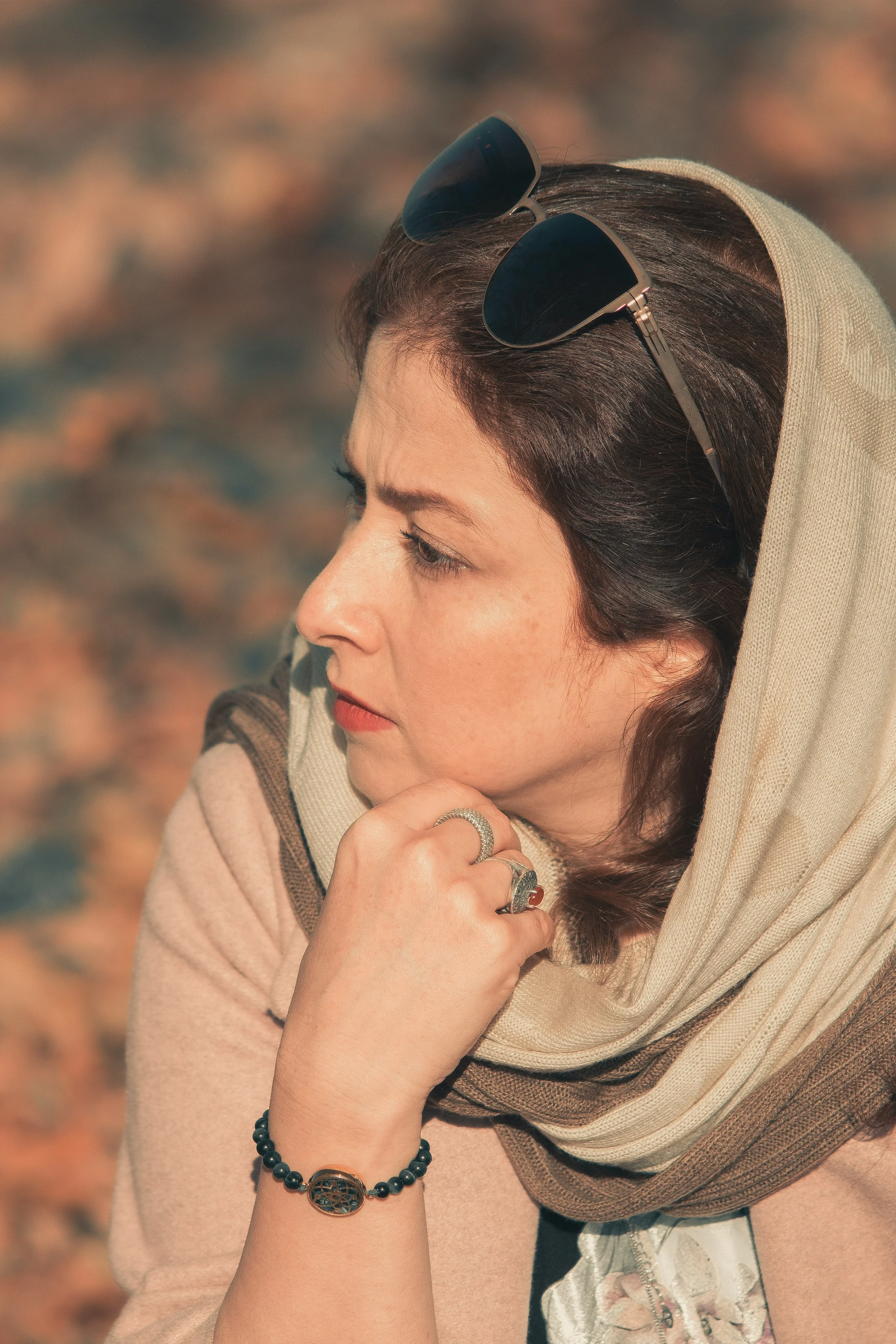 Woman in midlife reflecting on identity and recalibration in individual therapy