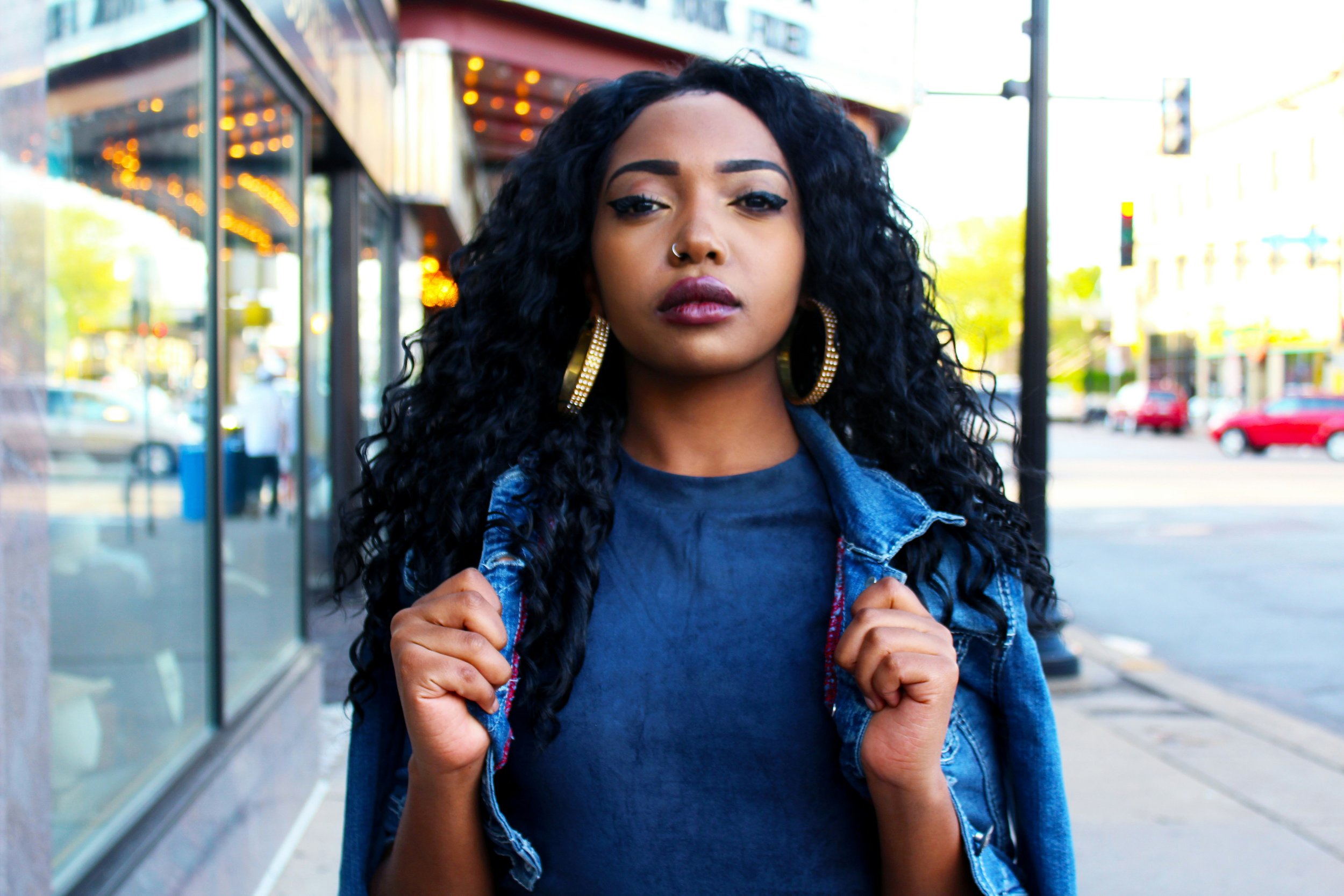 Strong woman walking down sidewalk