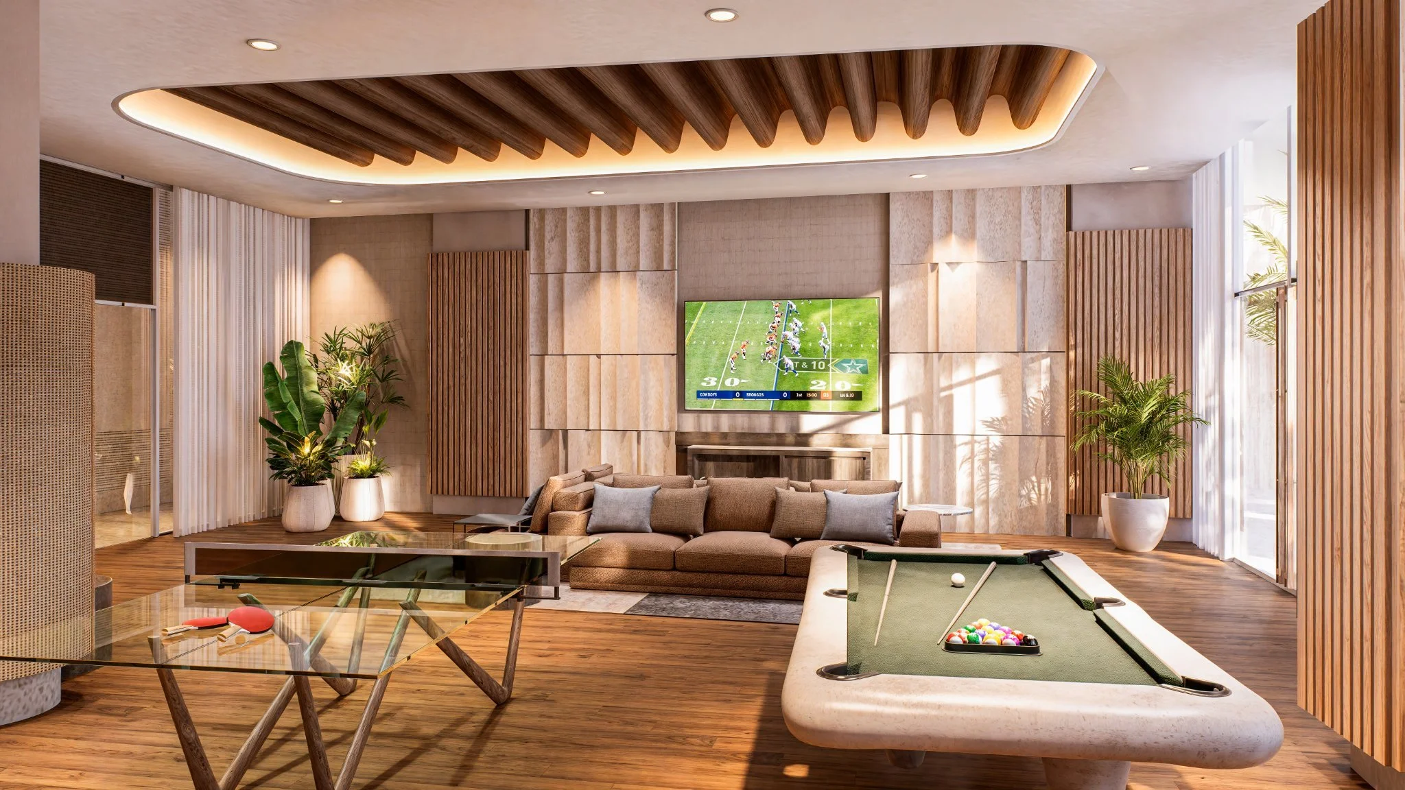Modern game room with a pool table, a sofa, potted plants, a wall-mounted TV showing football, and large windows with sheer curtains.
