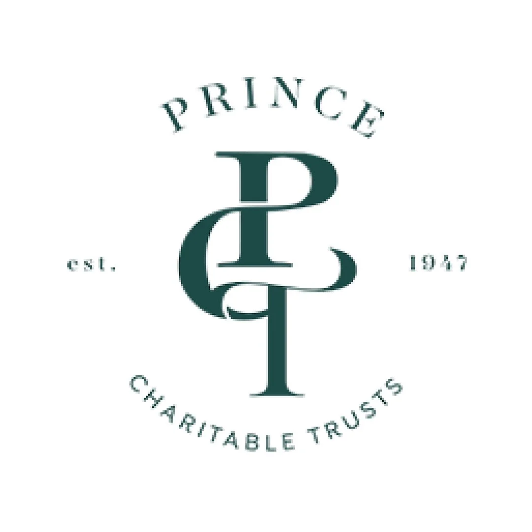 Logo with the words "Prince P" and "Charitable Trusts," established in 1947, arranged in a circular pattern.