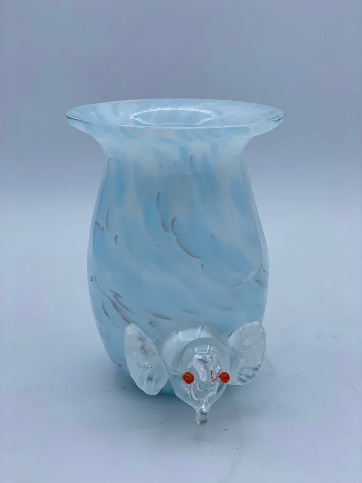 Decorative glass piece shaped like a mouse with glass ears and orange eyes, with a wide opening at the top.