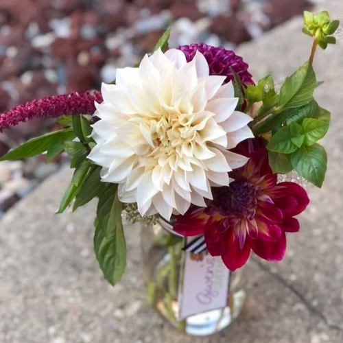 Bouquet with large white flower in a mason jar