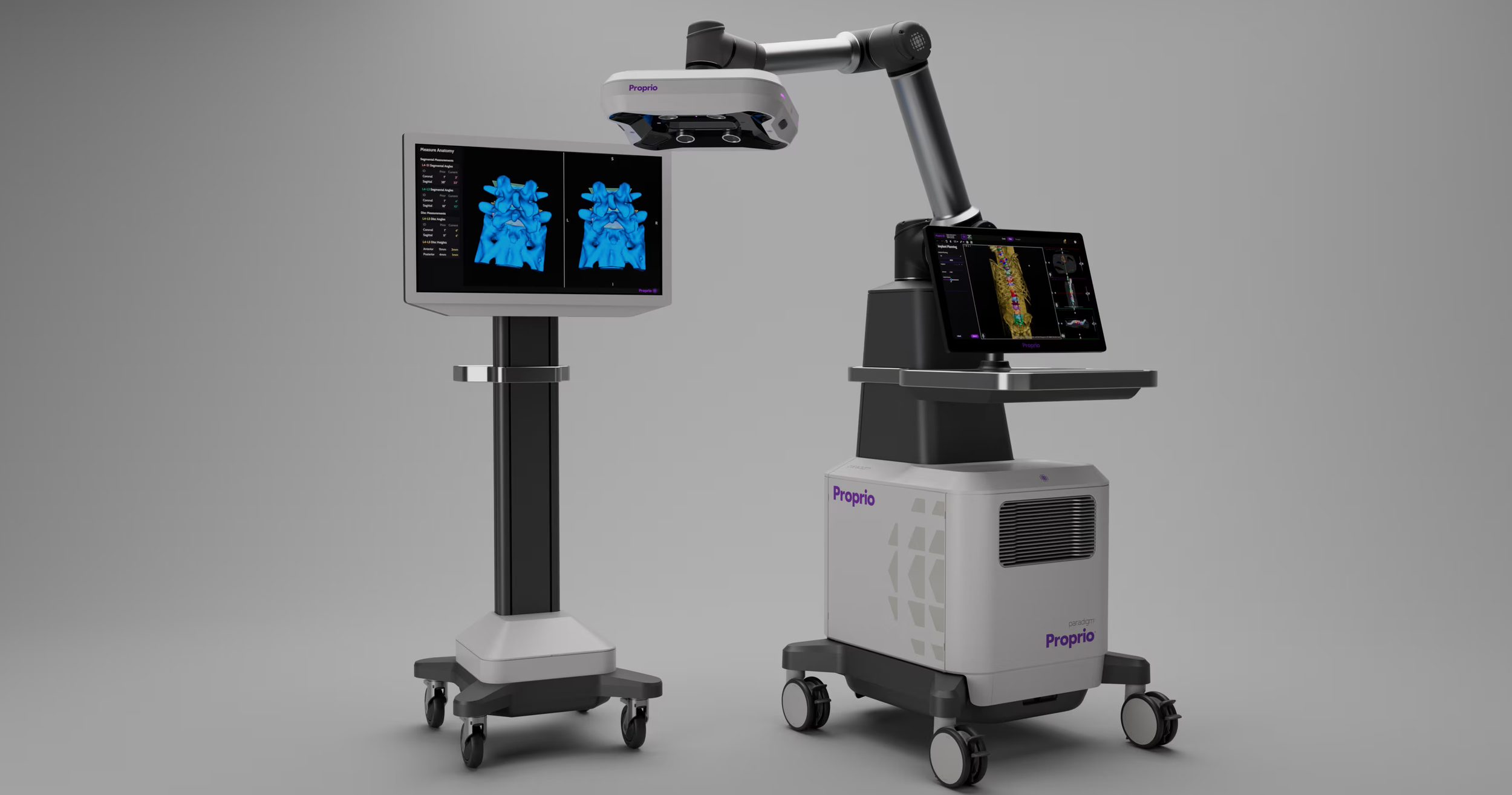 Proprio Paradigm Medical imaging equipment with a robotic arm, monitors, and a stand, used for advanced surgical procedures.