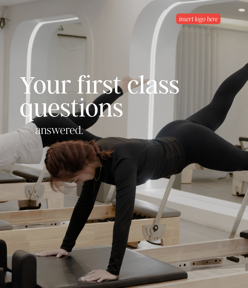 A woman in black activewear doing a plank exercise on a reformer machine in a fitness studio.