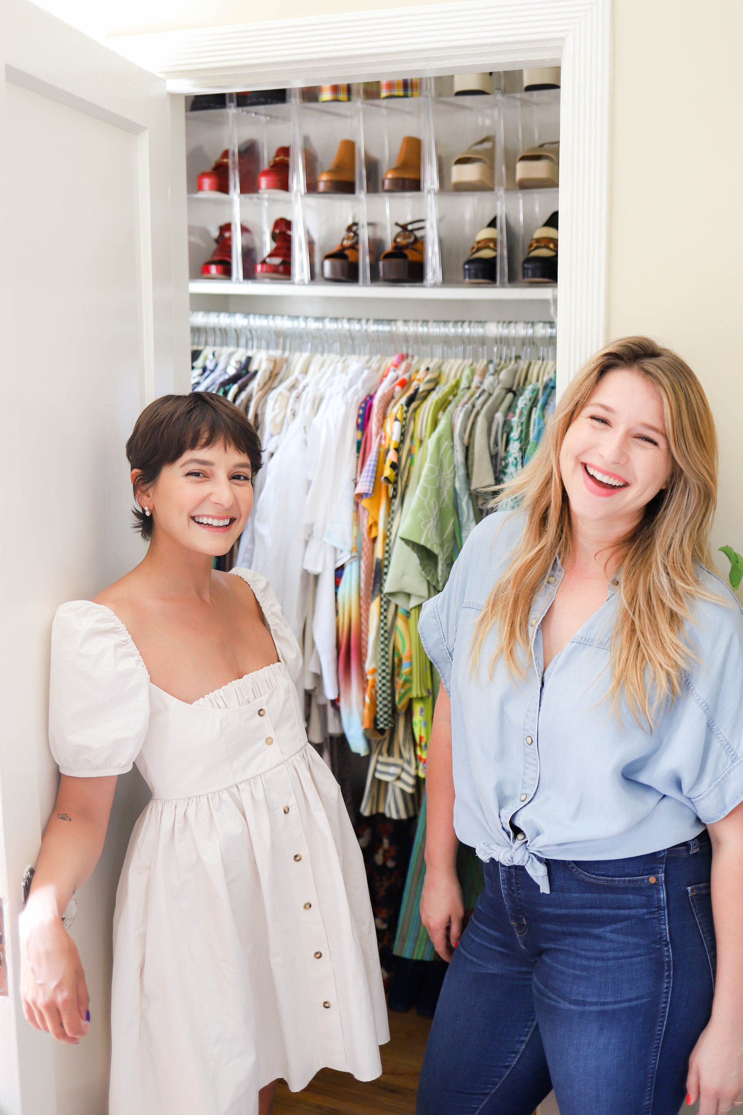 Julianna Strickland and Alyssa Coscarelli stand in front of her organized closet