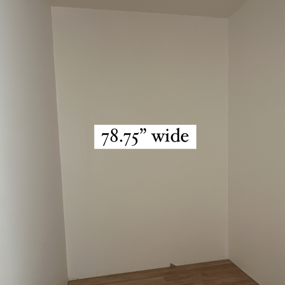 Empty corner of a room with beige walls and wood flooring, with the text '78.75" wide' overlayed in the center.