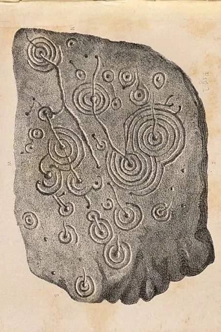 Ancient petroglyphs depicting concentric circles, spirals, and abstract symbols carved into rock.