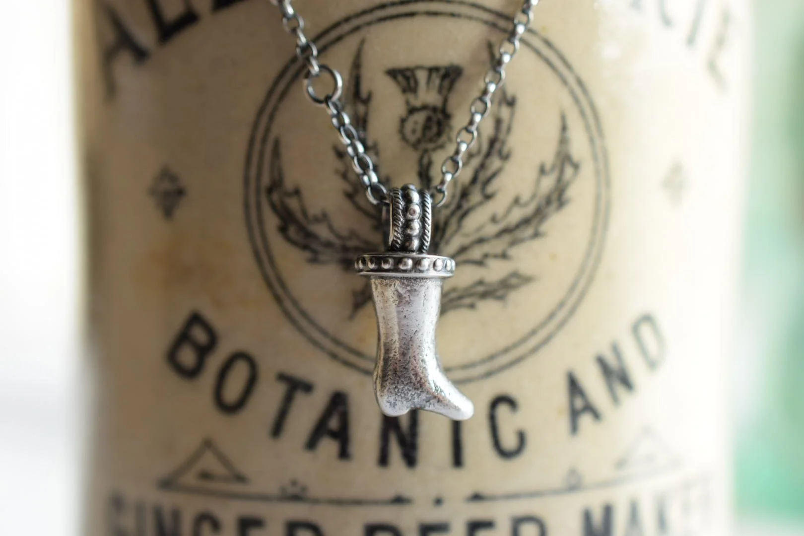 Sliver necklace made from a cast of a found antique dolls leg.