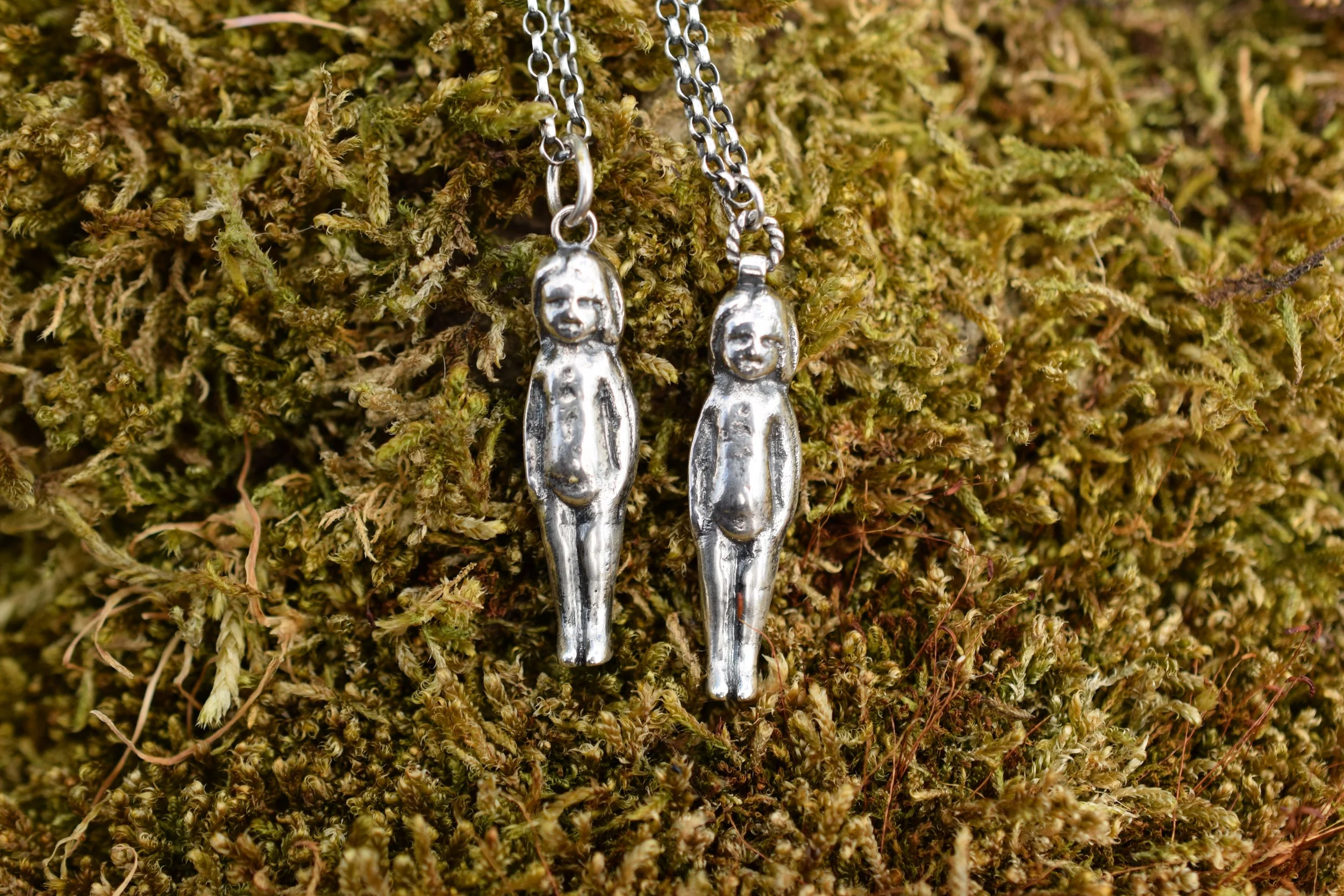 Pudding doll necklaces cast from our first tiny doll find in 2021. 