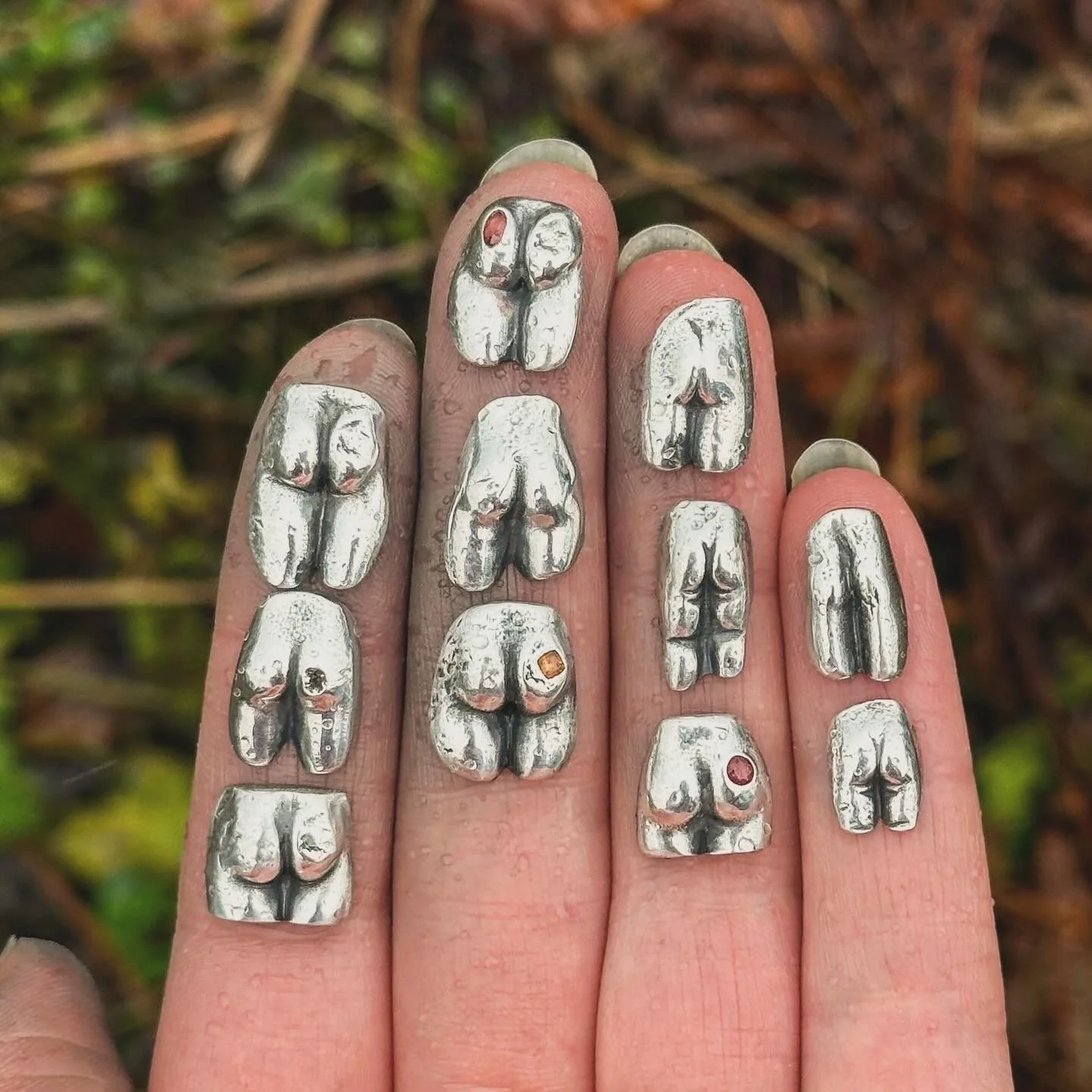 Silver dolls bottoms. Made from the impressions of our found antique dolls arses. 