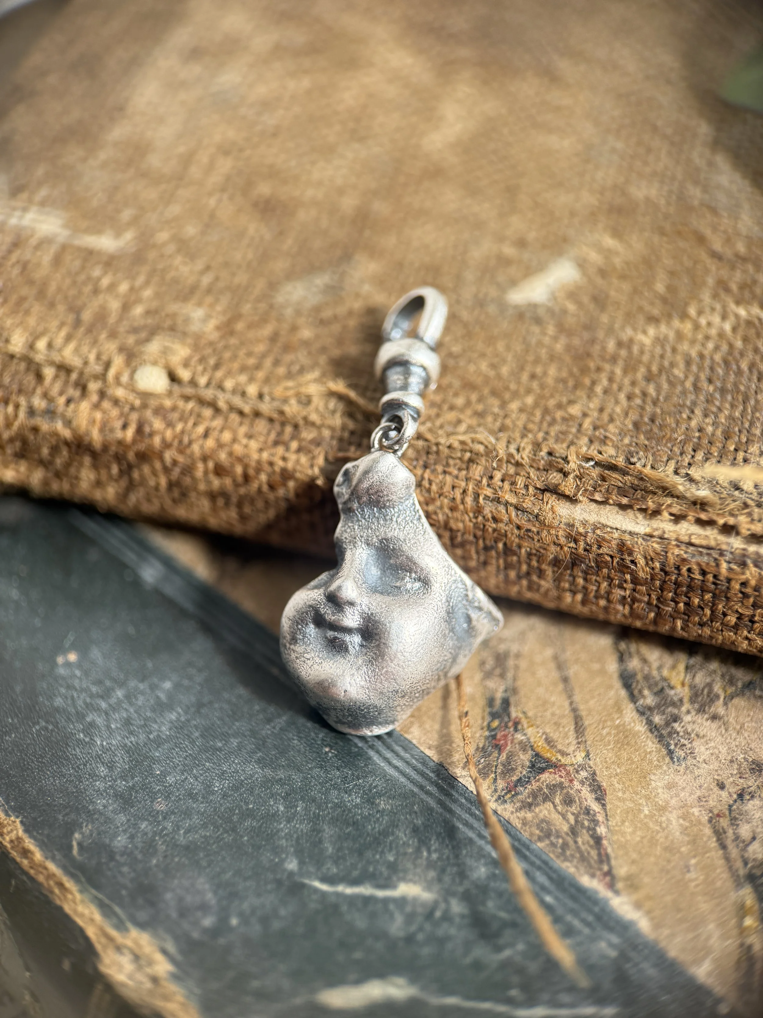 Doll Face Sherd Charm in Sterling Silver