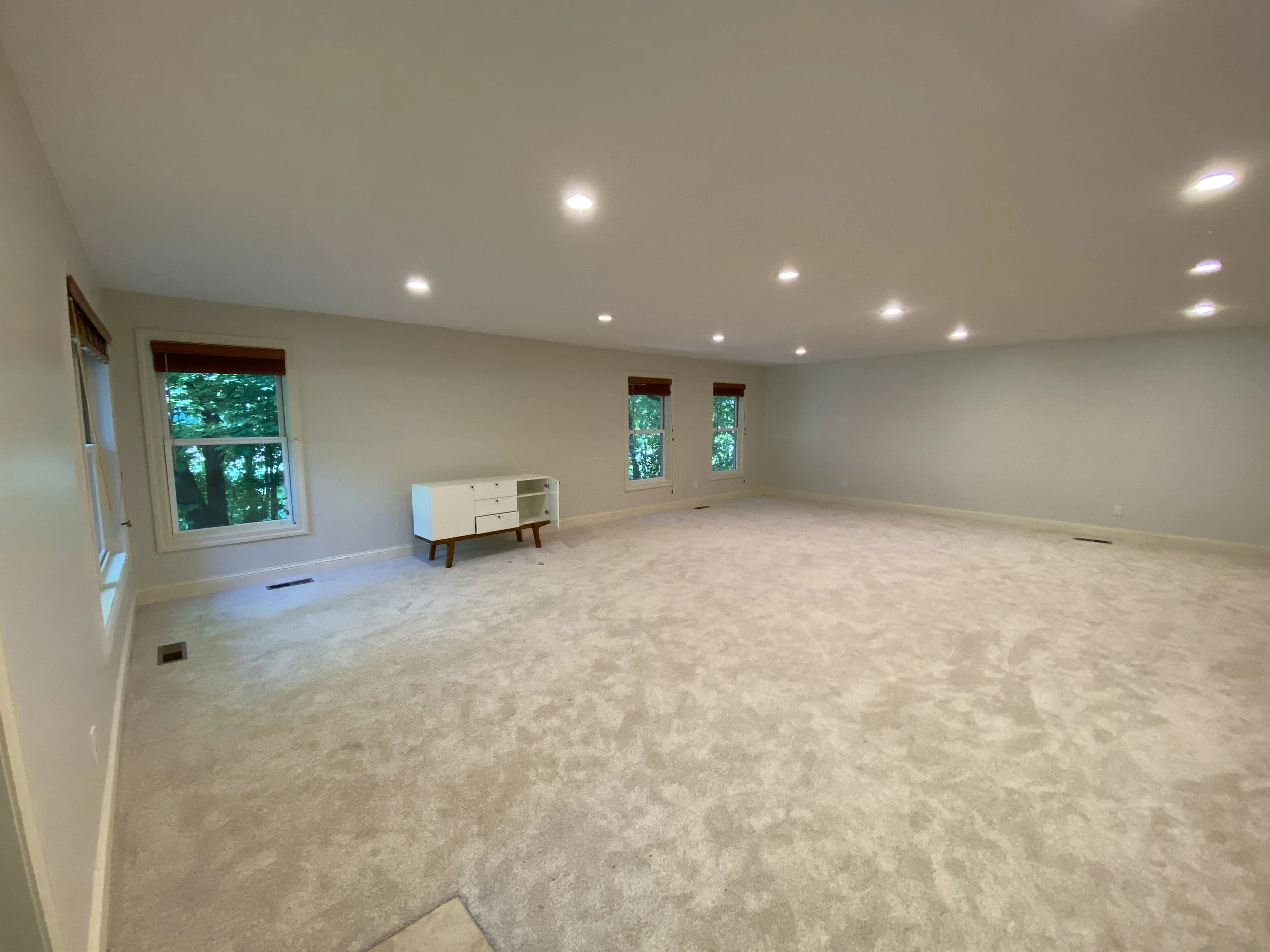 BEFORE: an empty living room lacks focus and purpose in Deephaven, MN