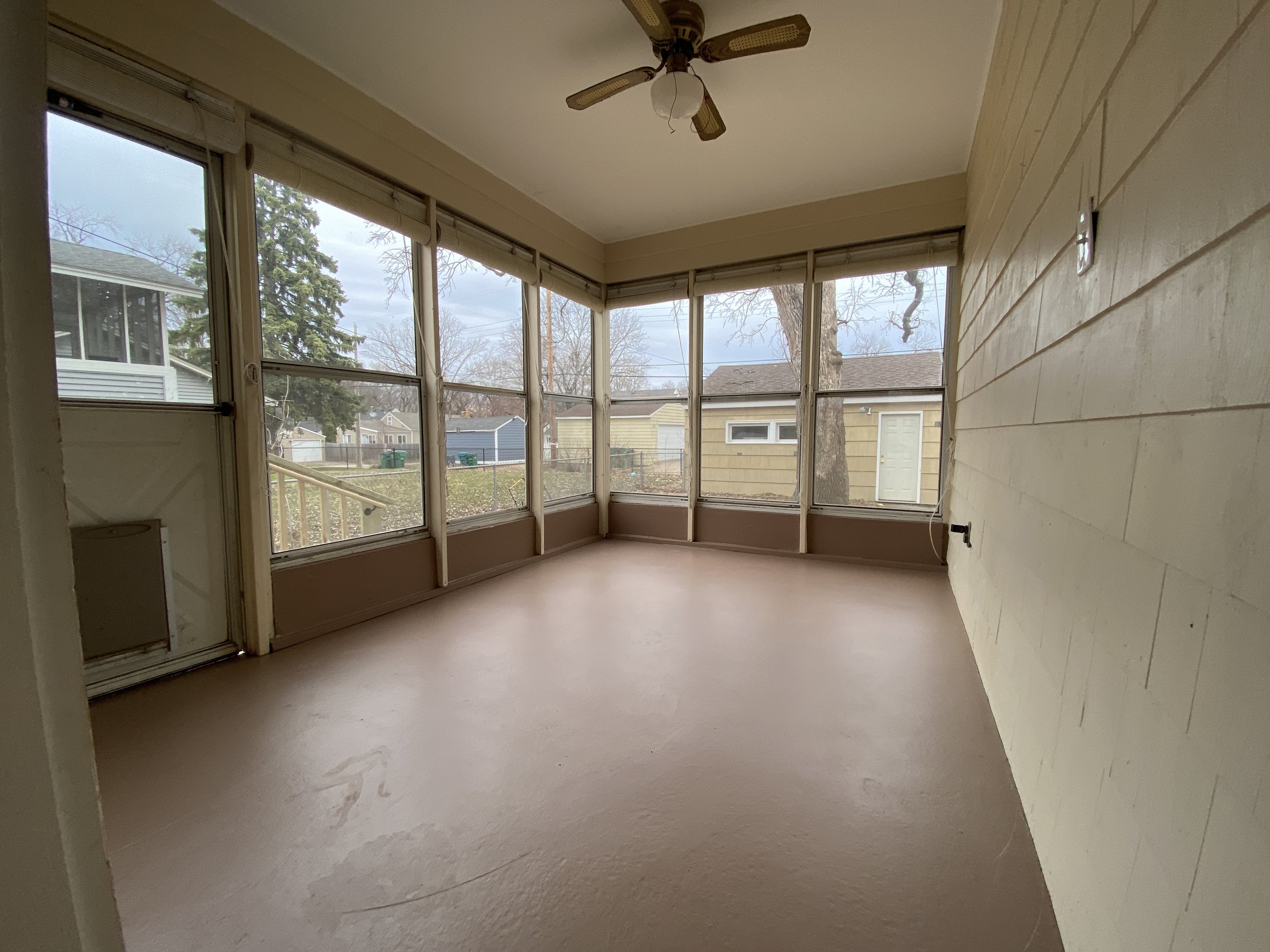 BEFORE: vacant three season porch sun room in Saint Louis Park, MN